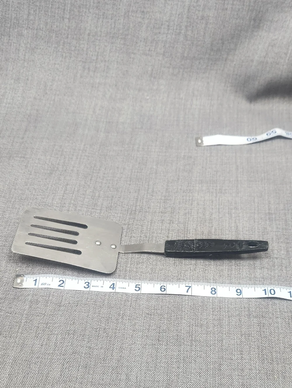 Vintage Stainless Steel Slotted Spatula Black Handle Made In Japan.
